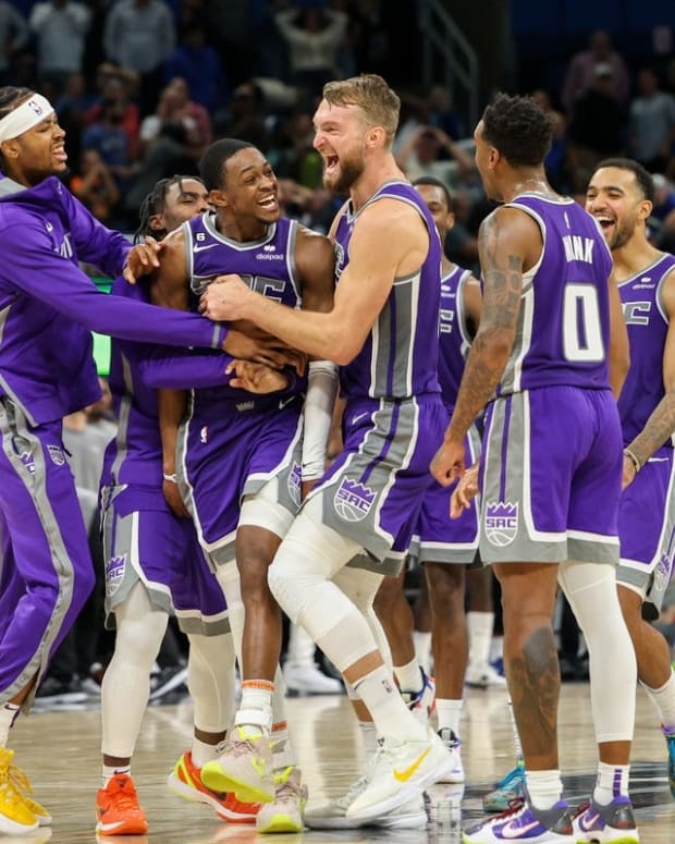 Nov 5, 2022; Orlando, Florida, USA; Sacramento Kings guard De'Aaron Fox (5) is congratulated after making a three pointer at the buzzer to beat the Orlando Magic in overtime at Amway Center. Mandatory Credit: Nathan Ray Seebeck-USA TODAY Sports